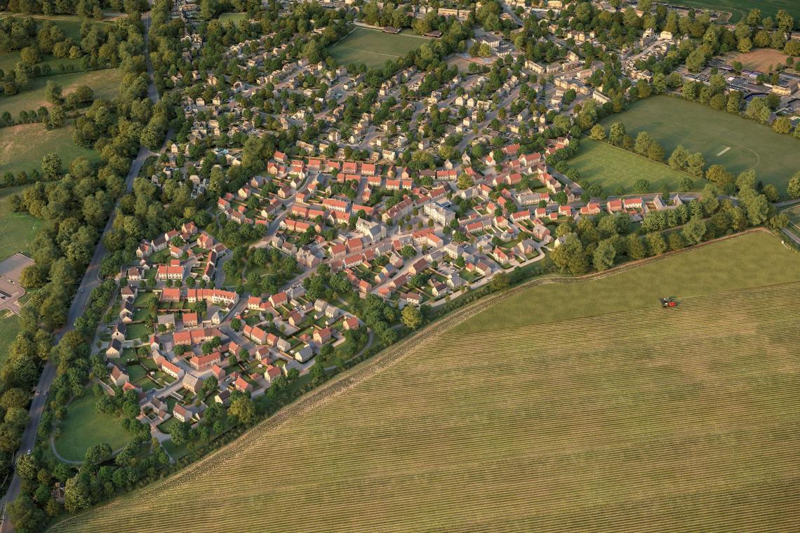 CGI aerial view of a new housing development beside fields on the edge of a town