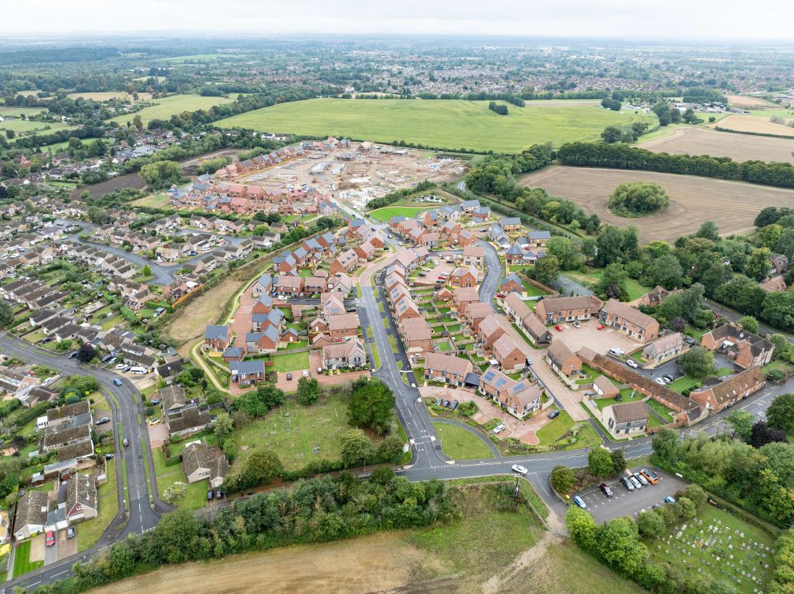 Aerial view of the Church Farm development in Radley with new homes under construction beyond